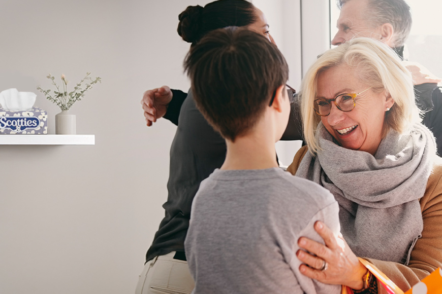 A woman welcoming a family member