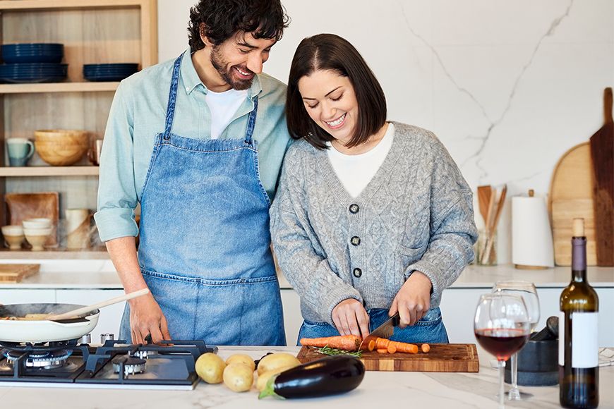 A couple cooking in the kitchen