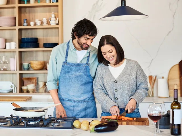 A couple cooking in the kitchen